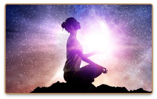 Energetic woman meditating under the starry sky