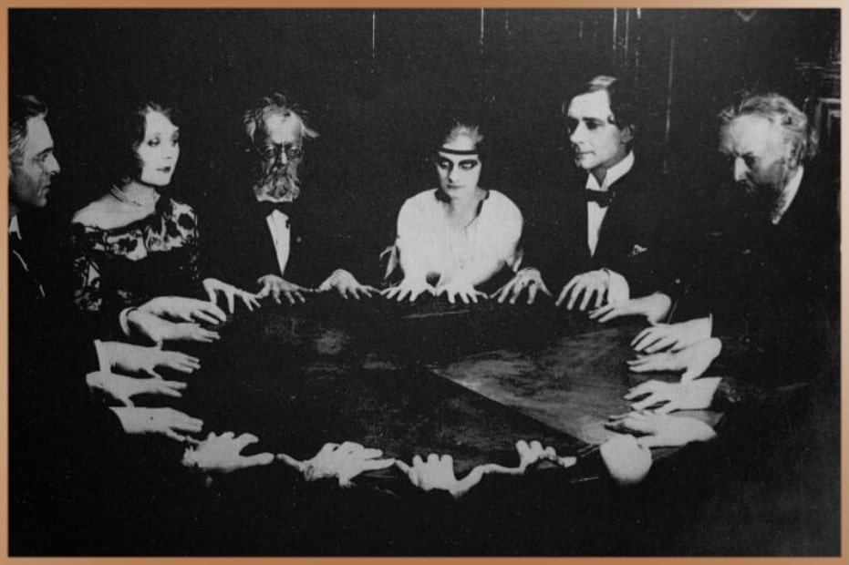 Group of people during a seance: an attempt to communicate with spirits.