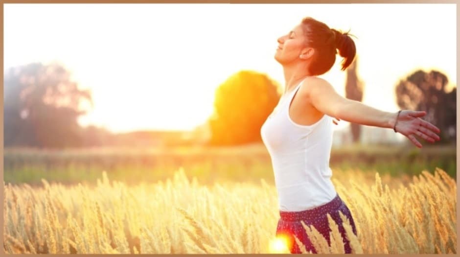 Healthy, sporty balanced woman in the nature at sunset