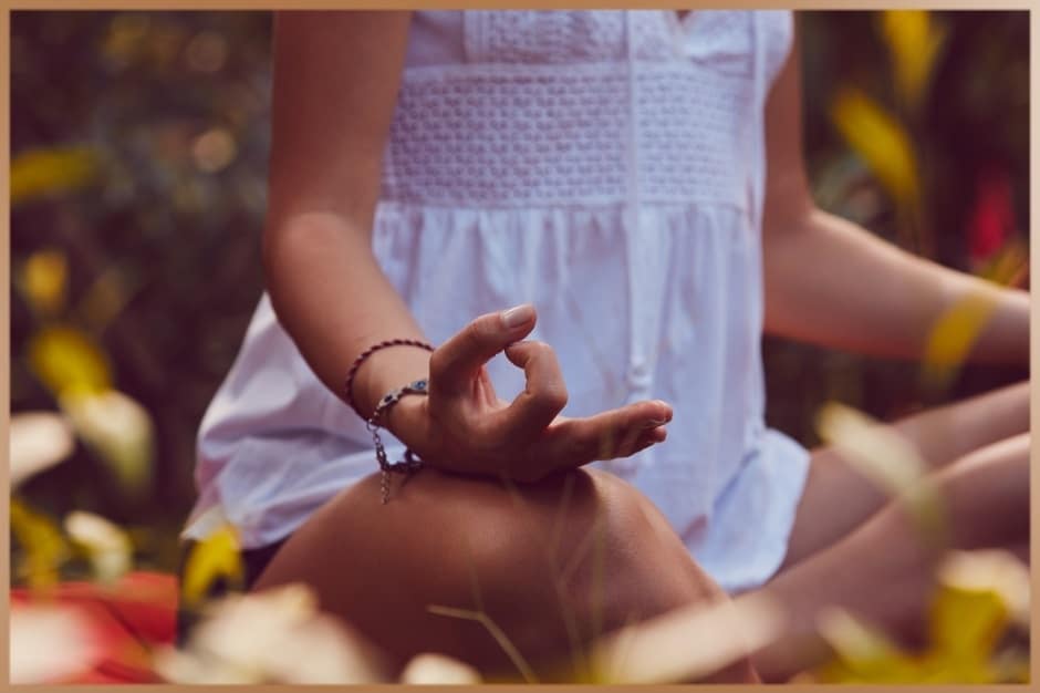 Woman practices meditation in nature