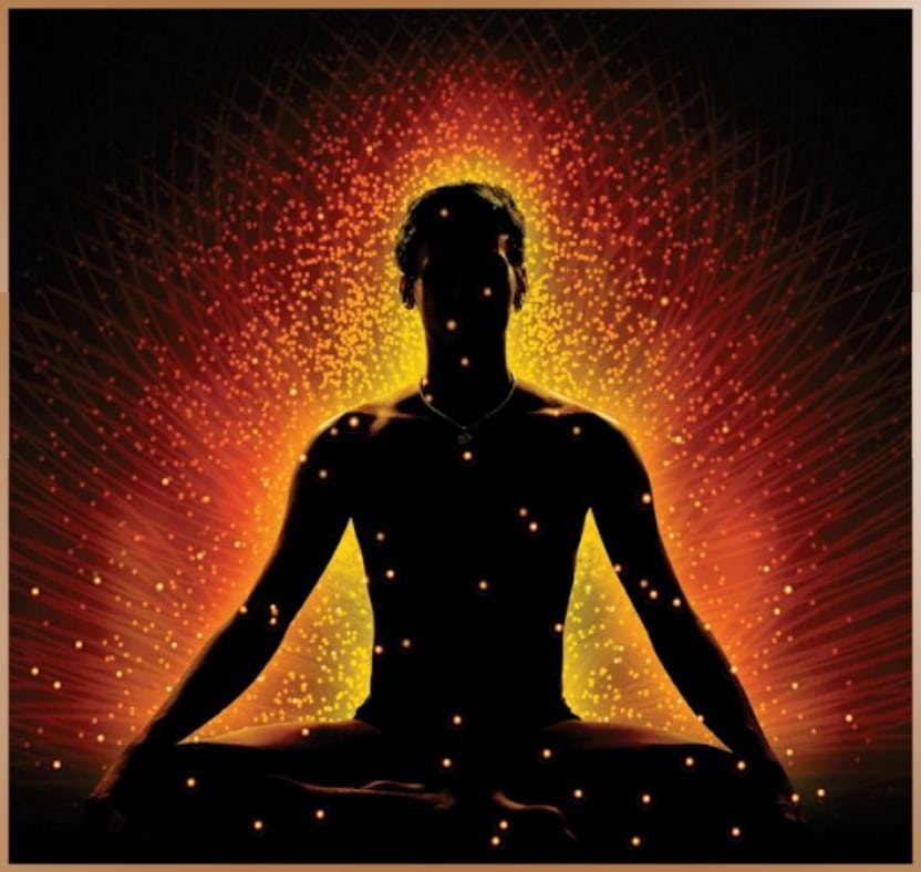 Figure of a meditating man with prana energy flowing in him