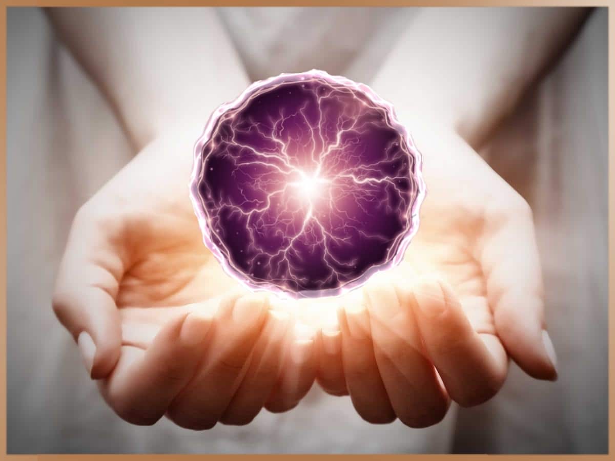 Purple psi ball for telekinesis in the hands of a woman