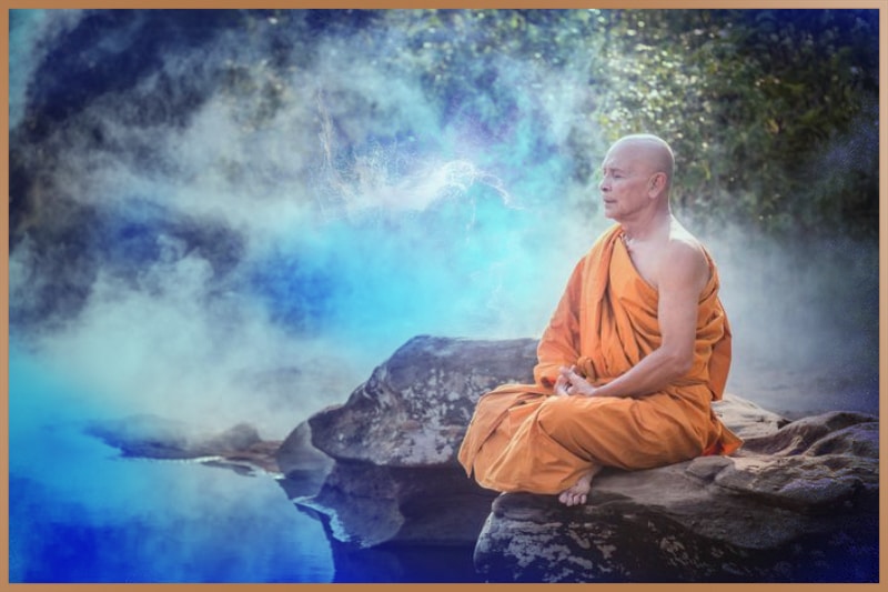 Tibetan monk is sitting and practicing meditation