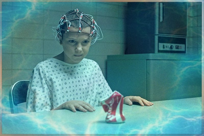 Young girl eleven from Stranger Things performing telekinesis by mind power