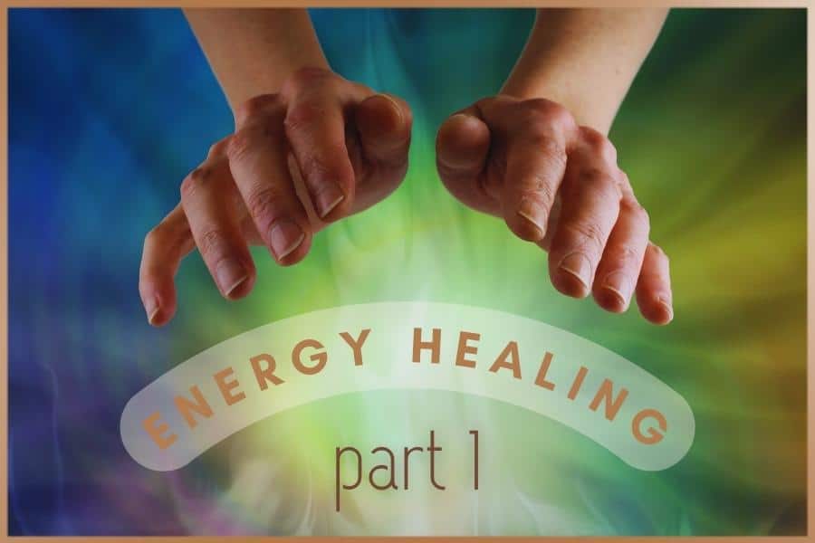 Hands of the energy healer and colorful energy around