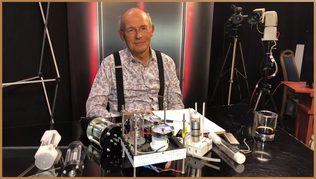 Dr. George Egely in a TV studio with experimental devices aimed at detecting and understanding life energy, a concept often overlooked by conventional science.