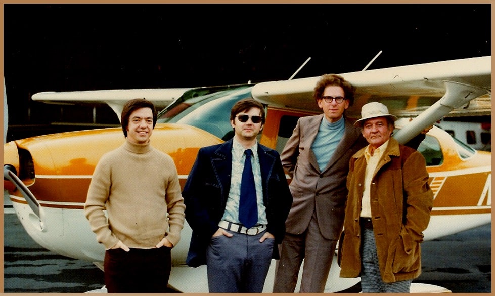 From left to right, Hal Puthoff, Kit Green, Russell Targ, and Pat Price in 1974, key members of the Stargate Project, posed before a small aircraft, representing their pioneering work in remote viewing research.